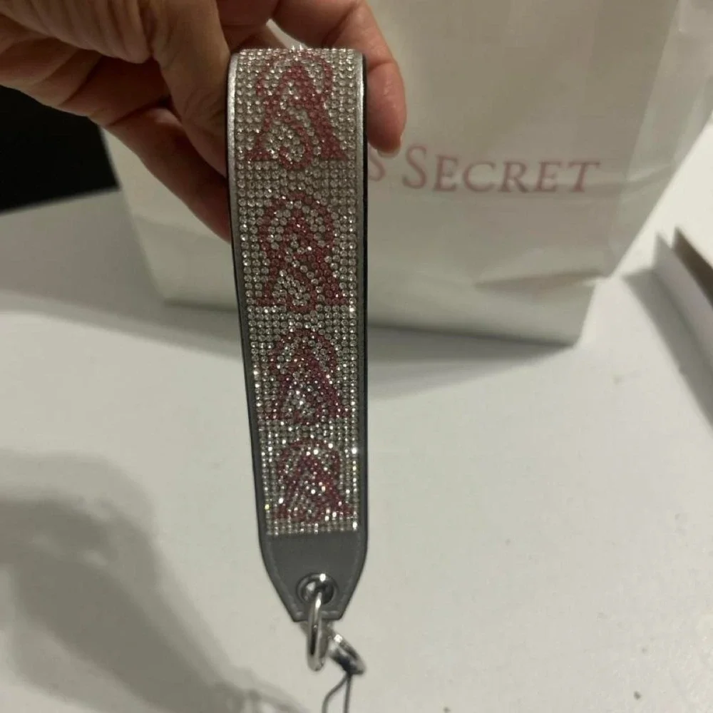 Victoria's Secret pink & silver rhinestone keychain with repeating V-shaped